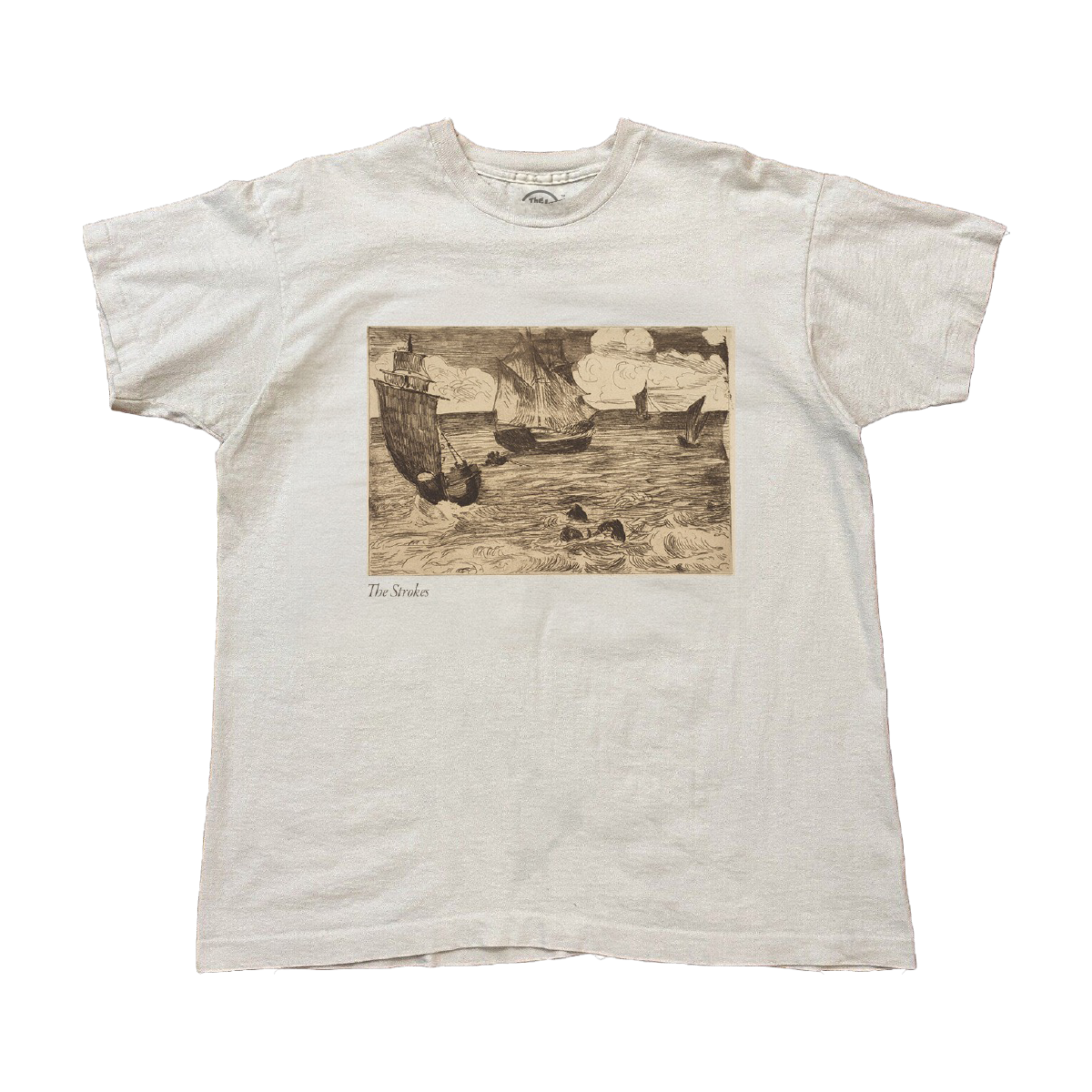White t-shirt with a vintage-style graphic of ships on water in between waves. A small The Stokes text is written underneath the image on the lower left. 